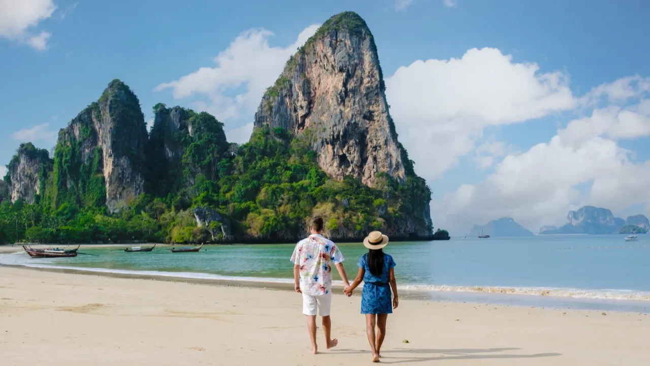 men and women relaxing on the beach during a vacation
