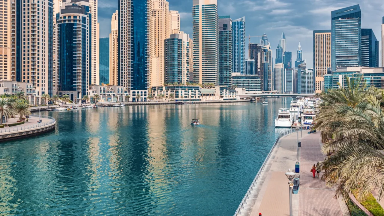 modern and developed dubai marina area with high skyscrapers and