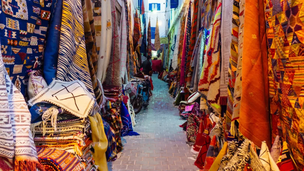 moroccan oriental carpets in a market in medina marrakech morocco