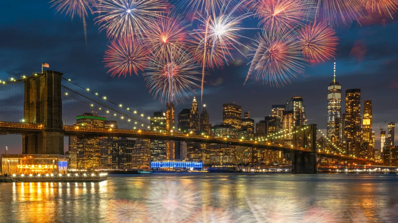 multicolor firework celebration over scene of new york cityscape with