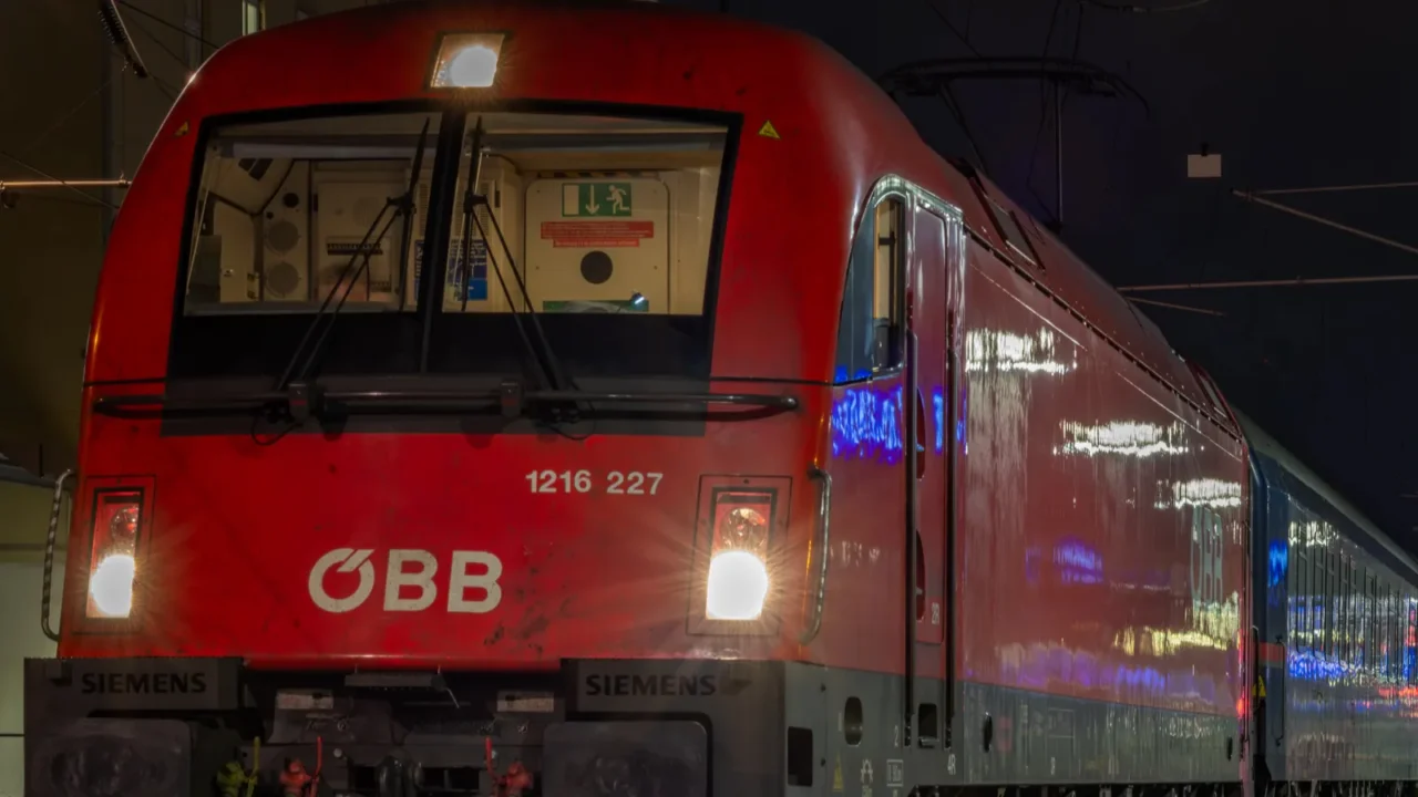night train from graz to berlin near platform in evening