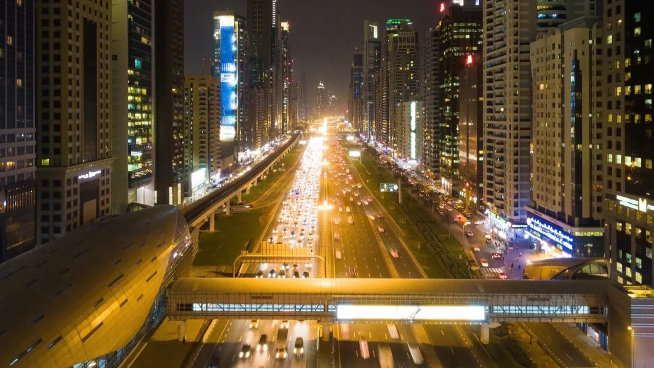night view of dubai city with roads skyscrapers and bright