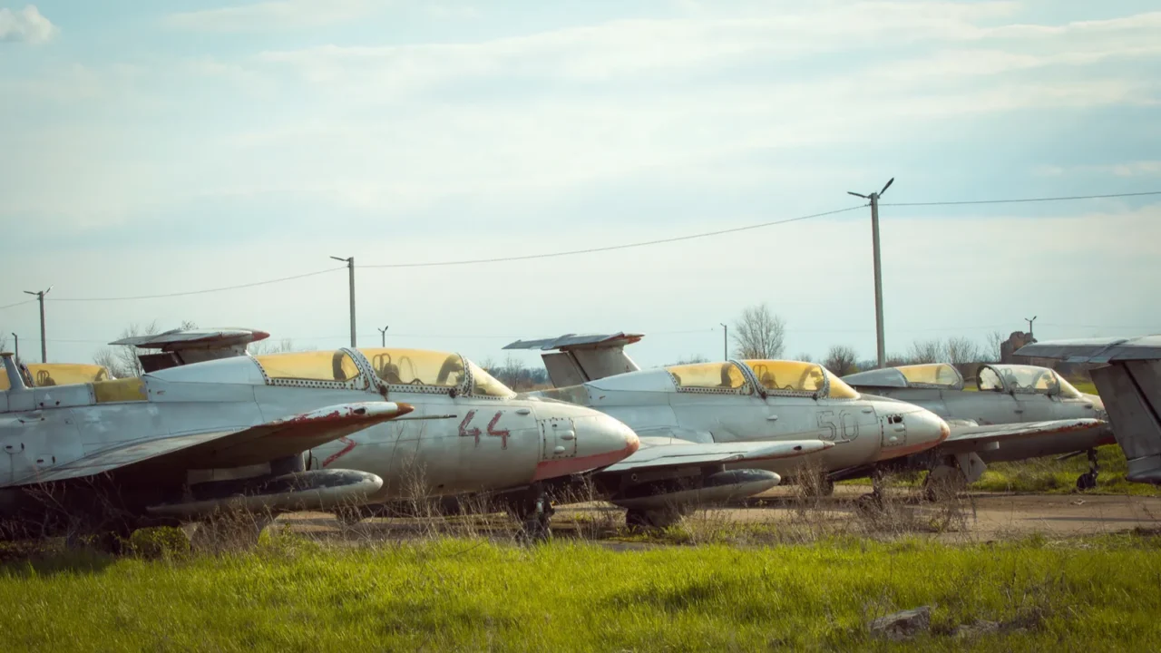 old soviet military aircraft standing at the airfield rusty used