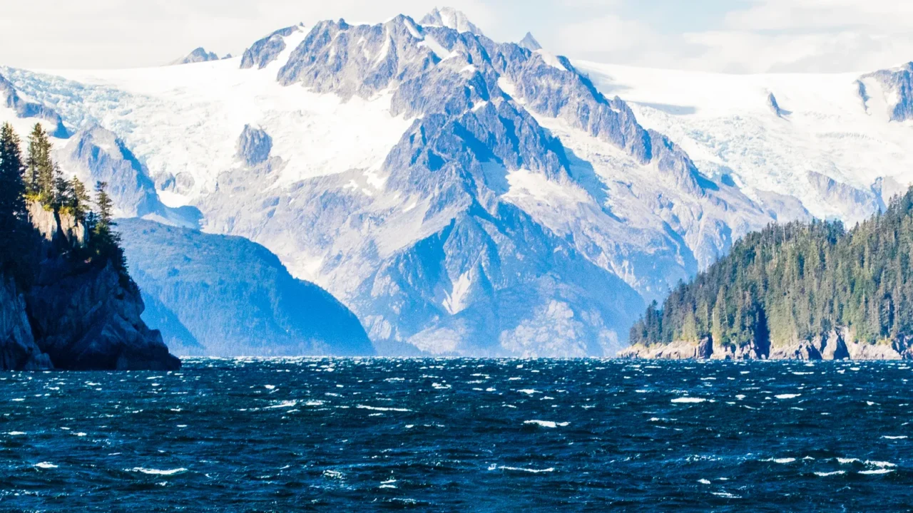 orca breath below the glaciers