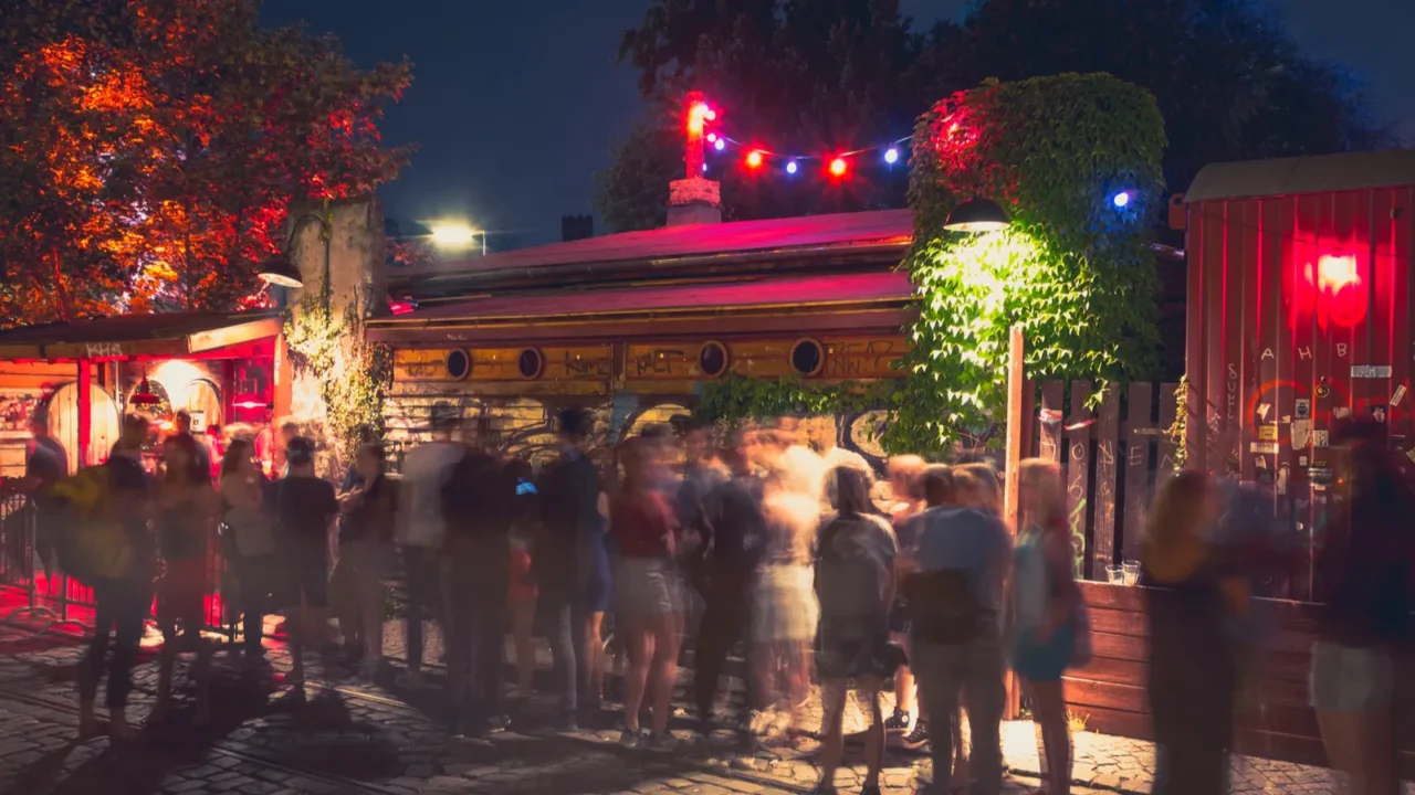 people at outdoor club in berlin at night