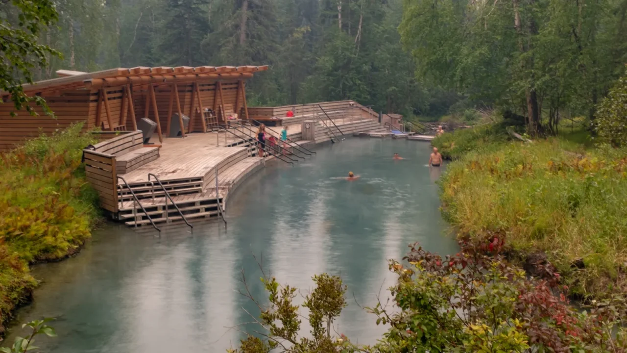 people enjoying the therapeutic hot waters of liard river