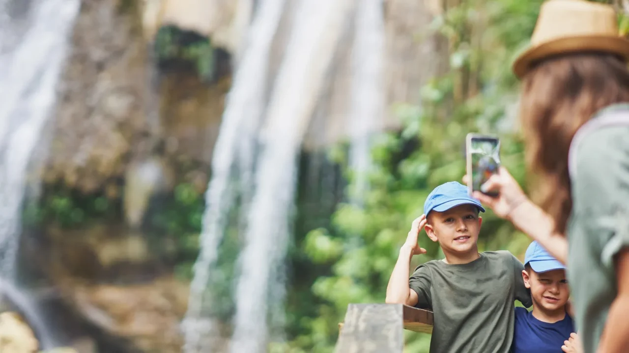 photo of mother with kids in gozalandia waterfalls high quality