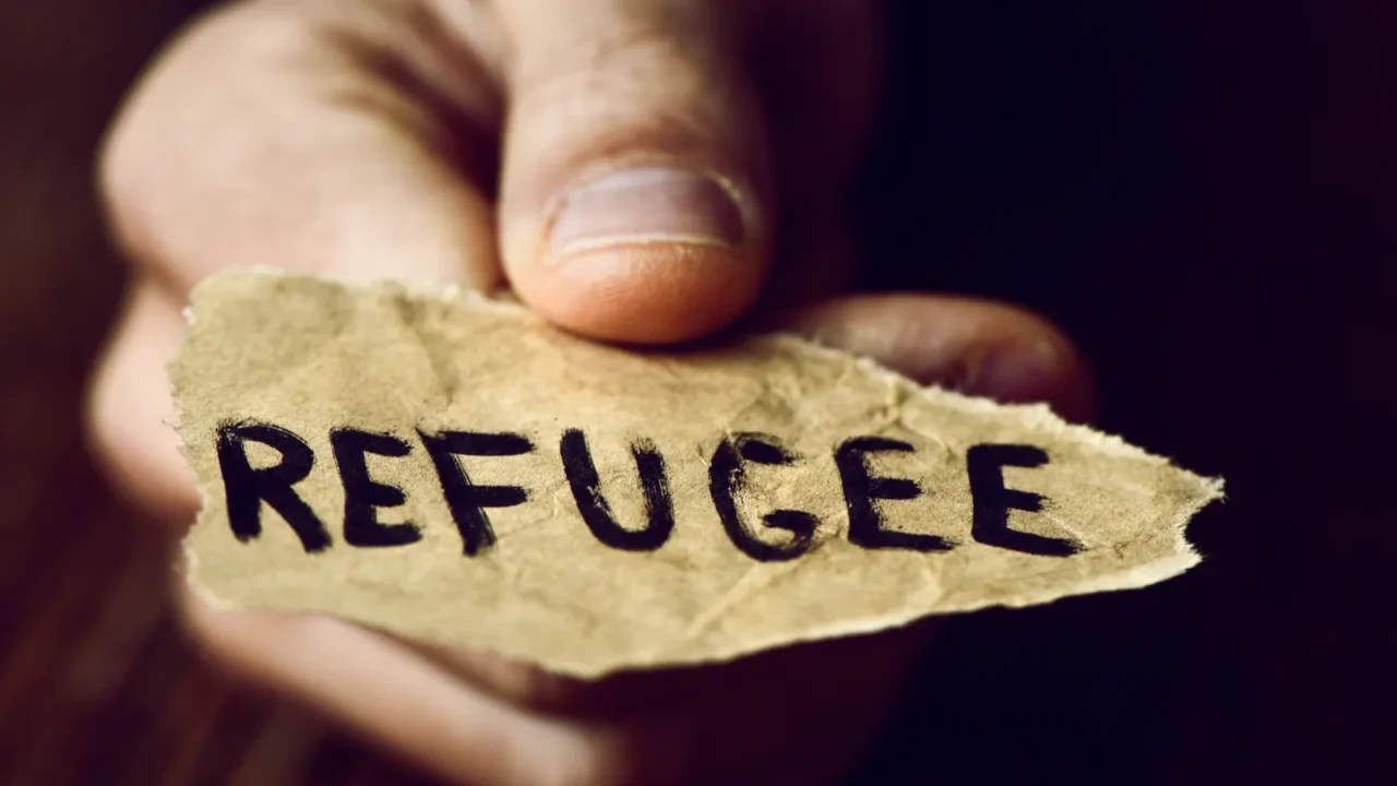 piece of paper with the word refugee