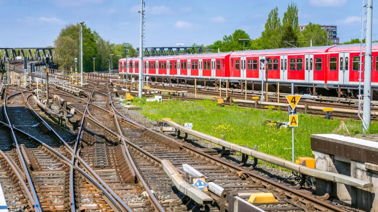 railway tracks at a train station and blue sky