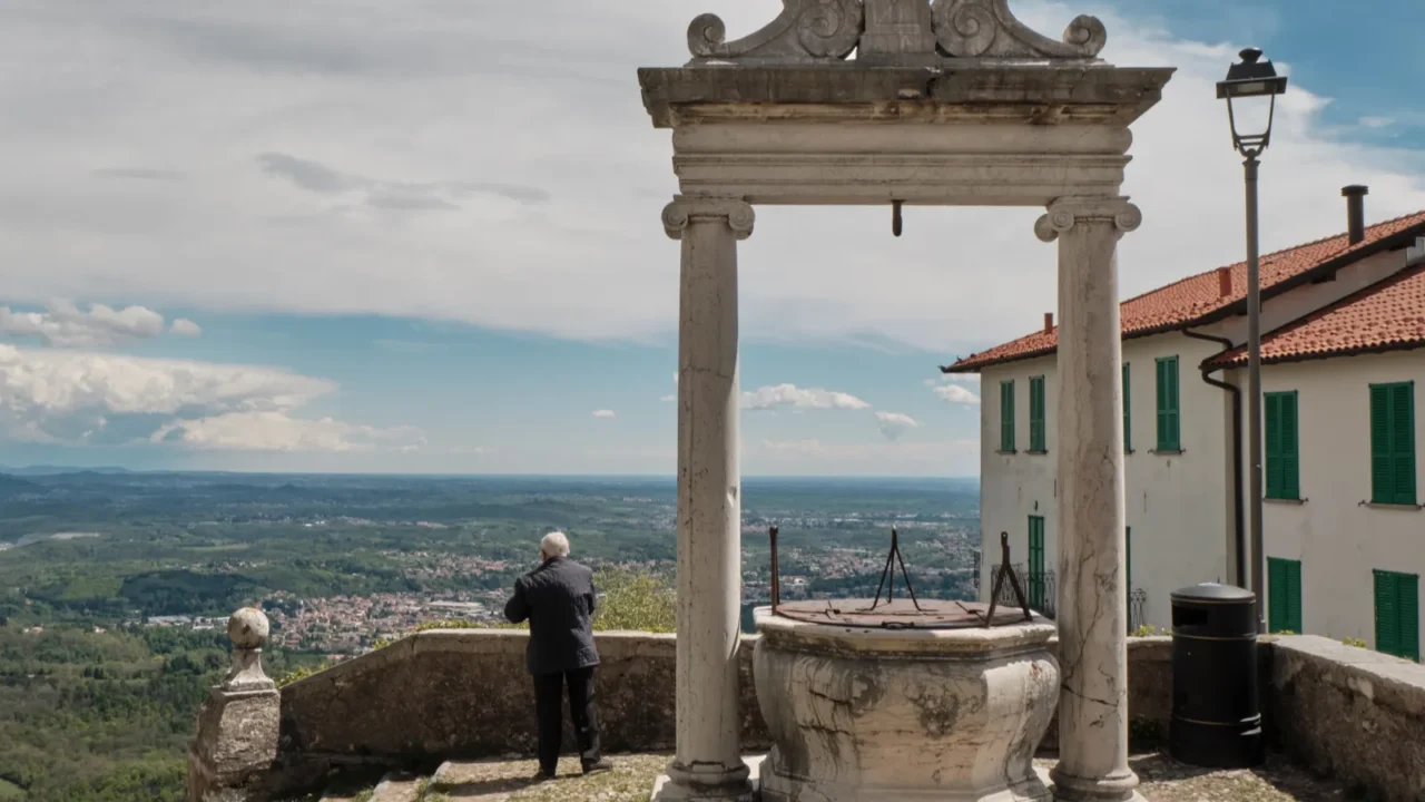 senior old man looking panorama from the top of sacred