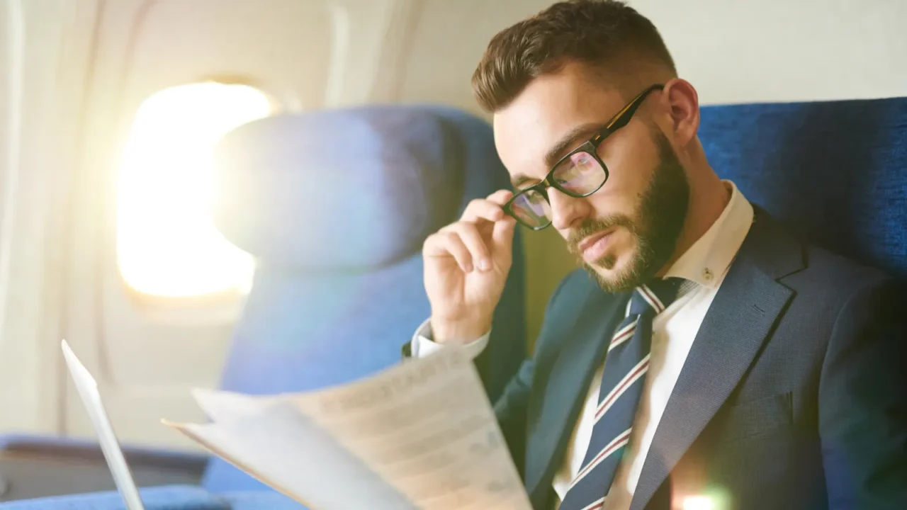 side view portrait of handsome bearded businessman reading document