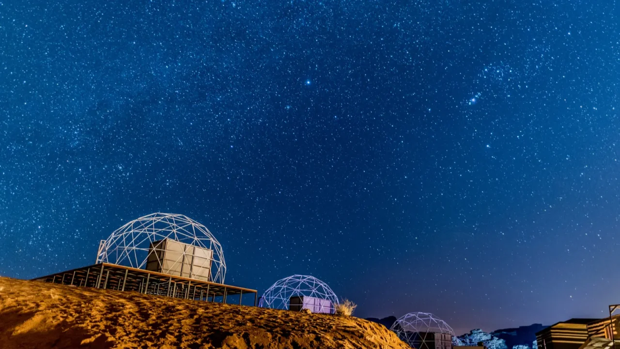 starry night with martian dome in a desert camp in