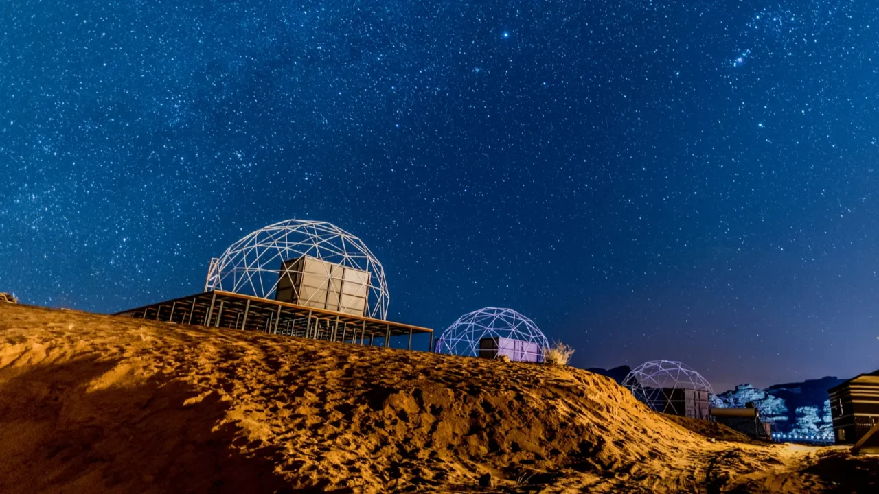 starry night with martian dome in a desert camp in