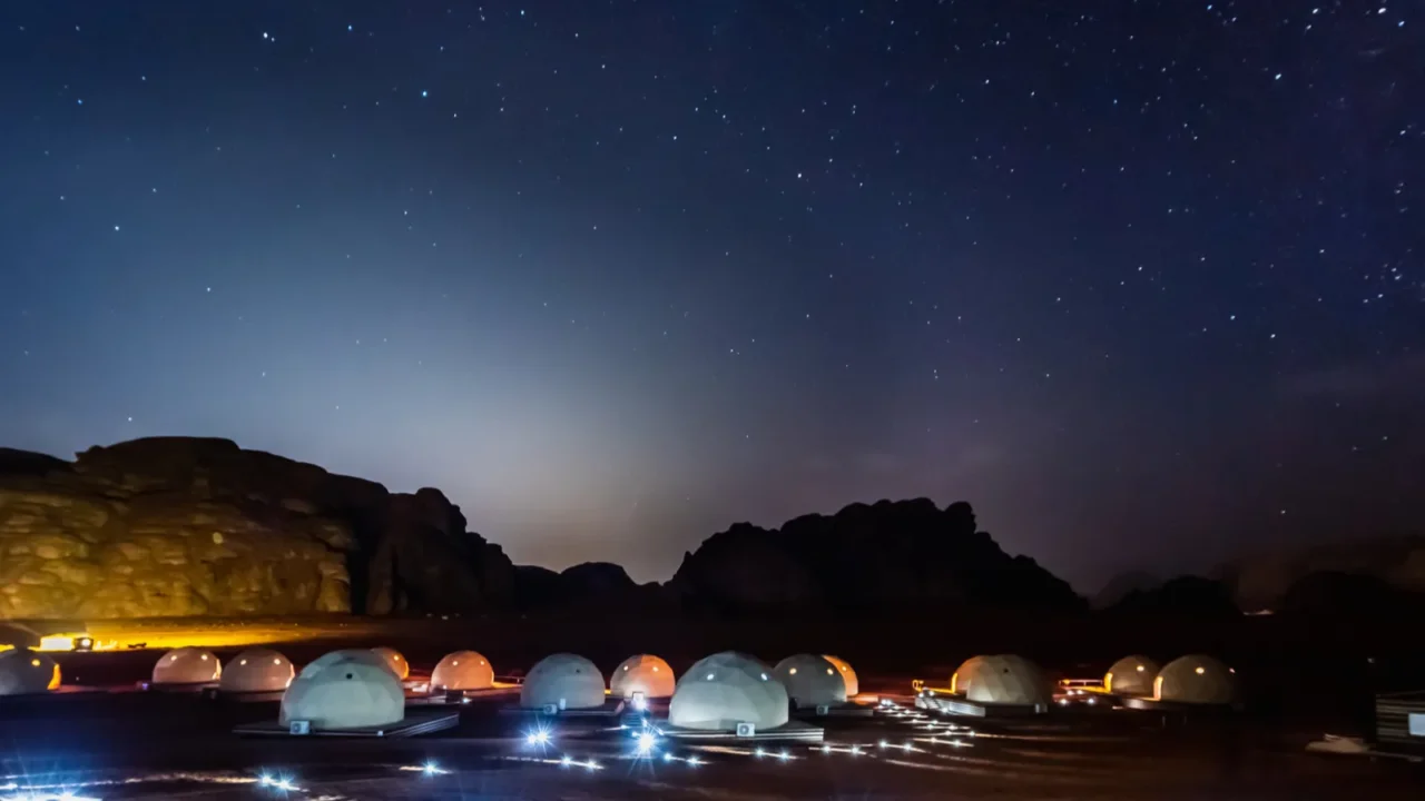 stars above martian dome tents in wadi rum desert jordan
