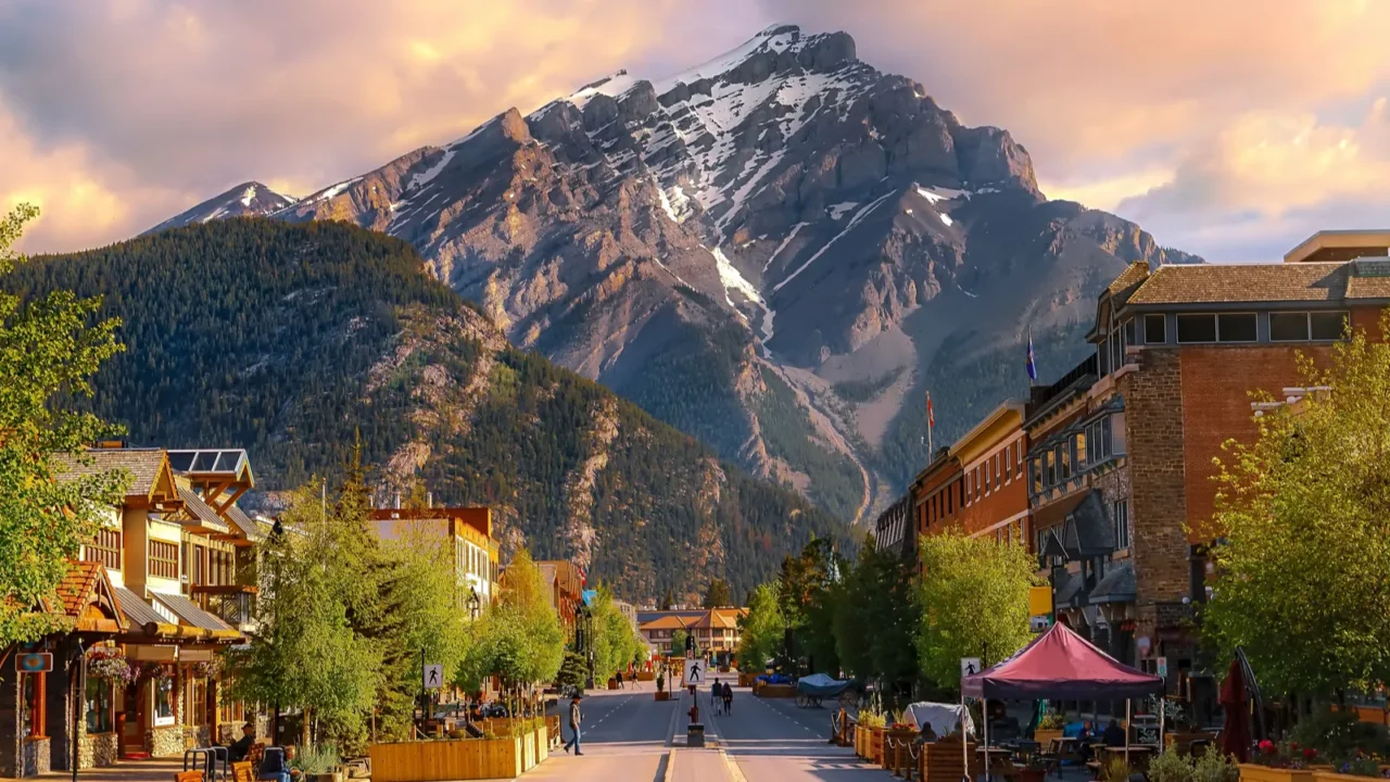 sunrise clouds over a mountain road through the town of