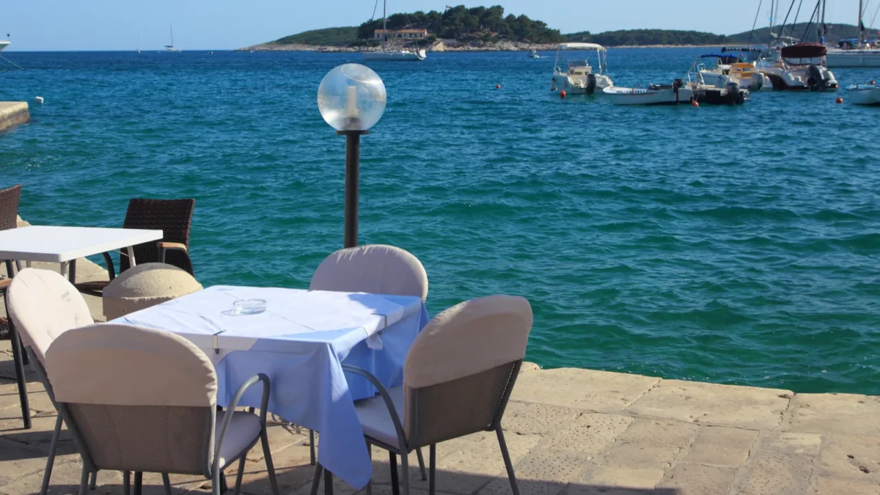 tables of cafe on the embankment of the city of