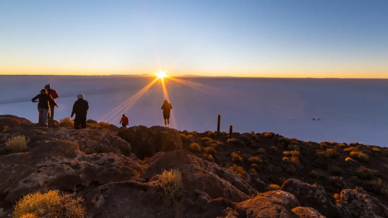 the rising sun over uyuni salt flat bolivia