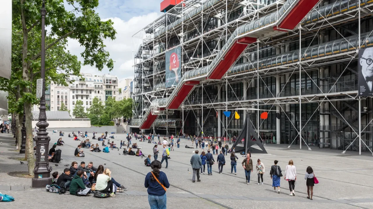 tourists relaxing in front of the centre pompidou in paris