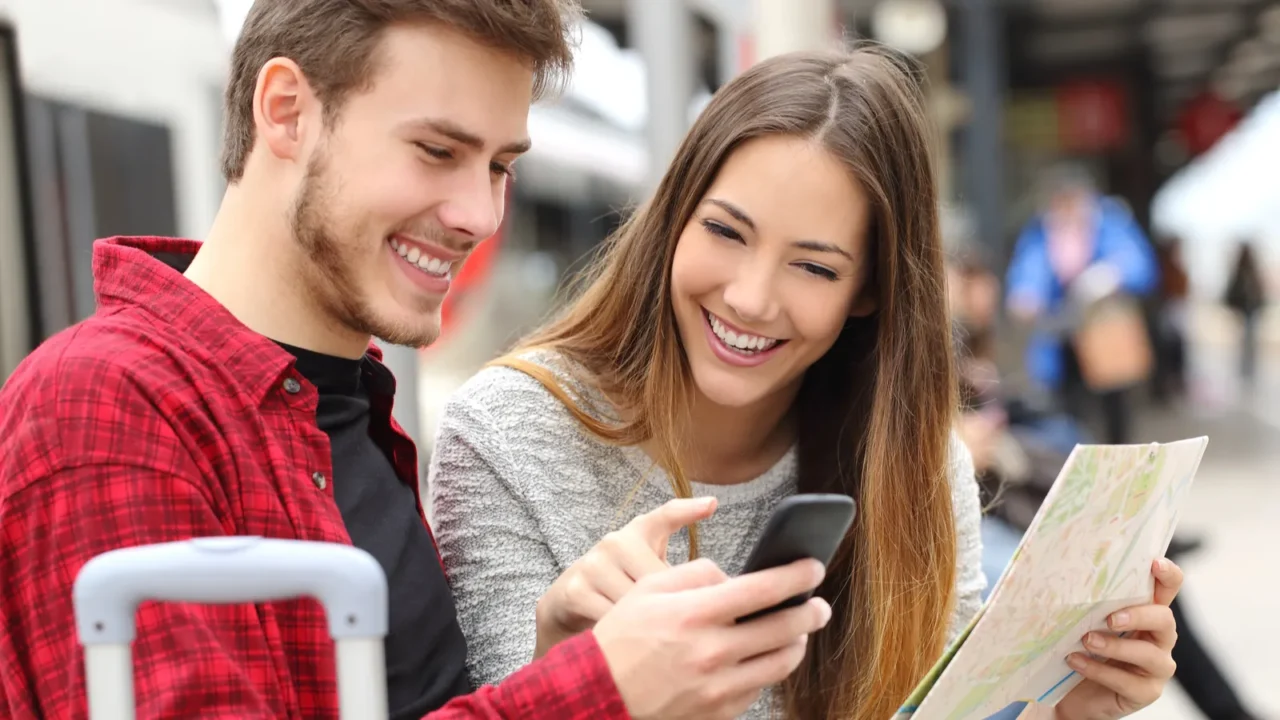 tourists travelers consulting gps and guide