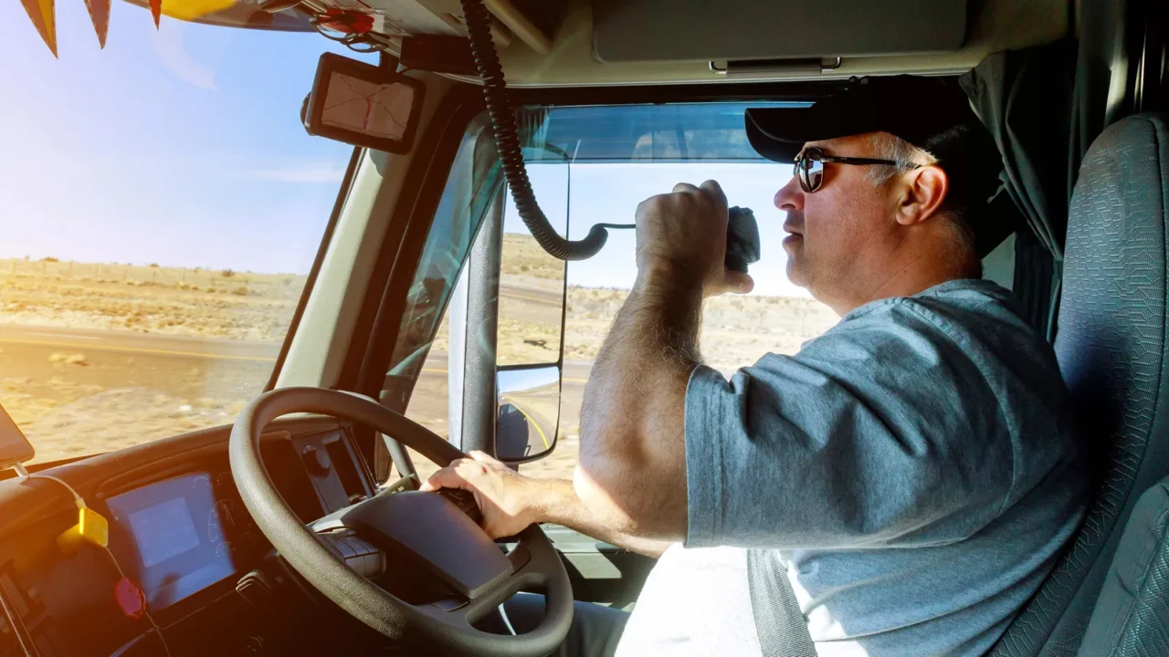 truck drivers big truck right traffic hands holding radio and