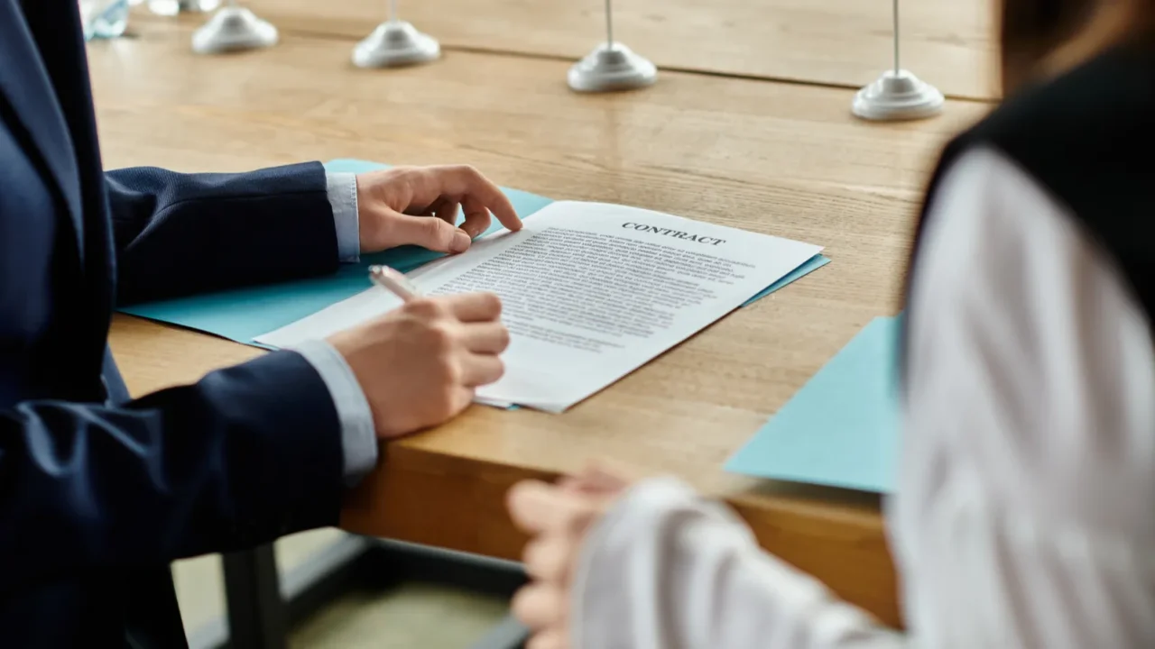 two teenagers participate in a un model conference signing a
