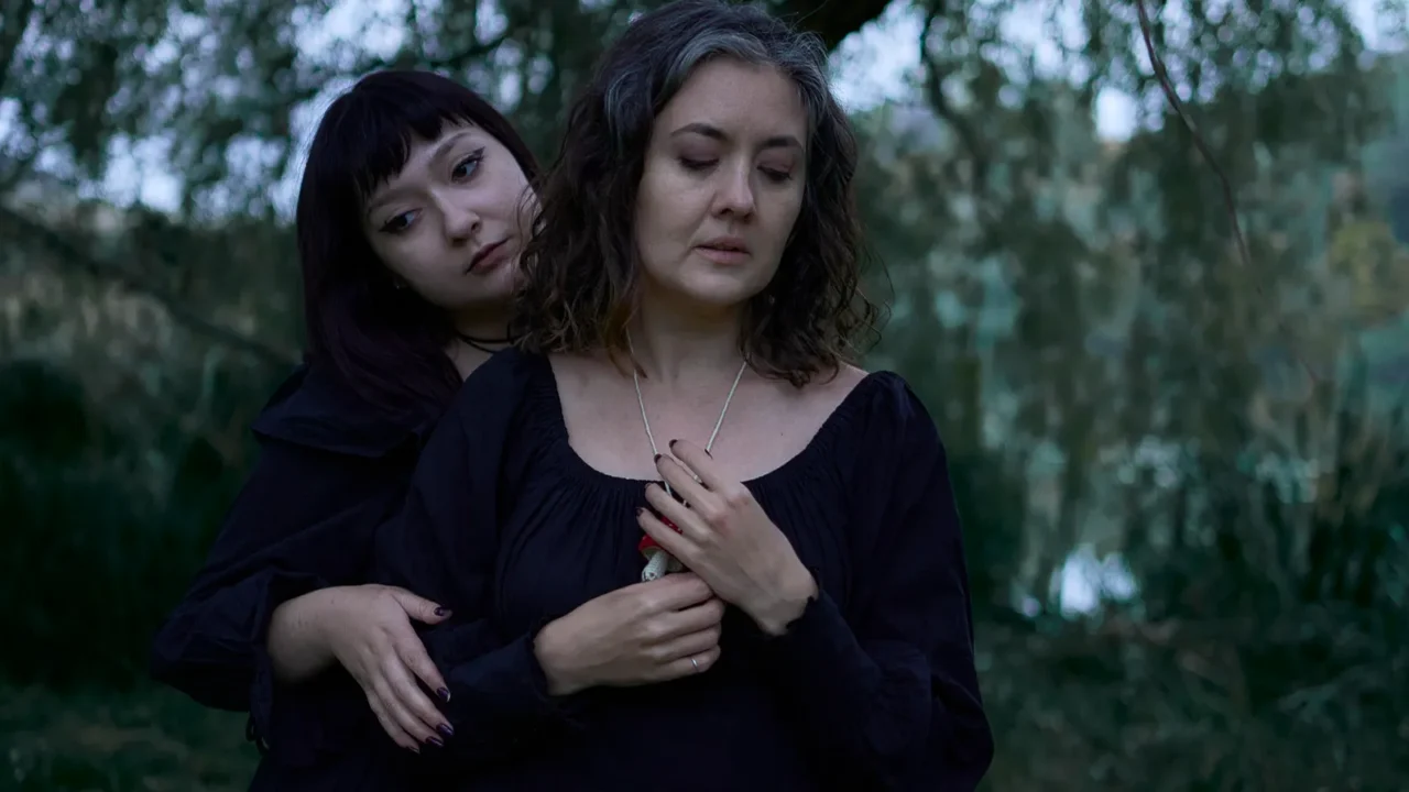 two women in black long dresses on halloween brides of