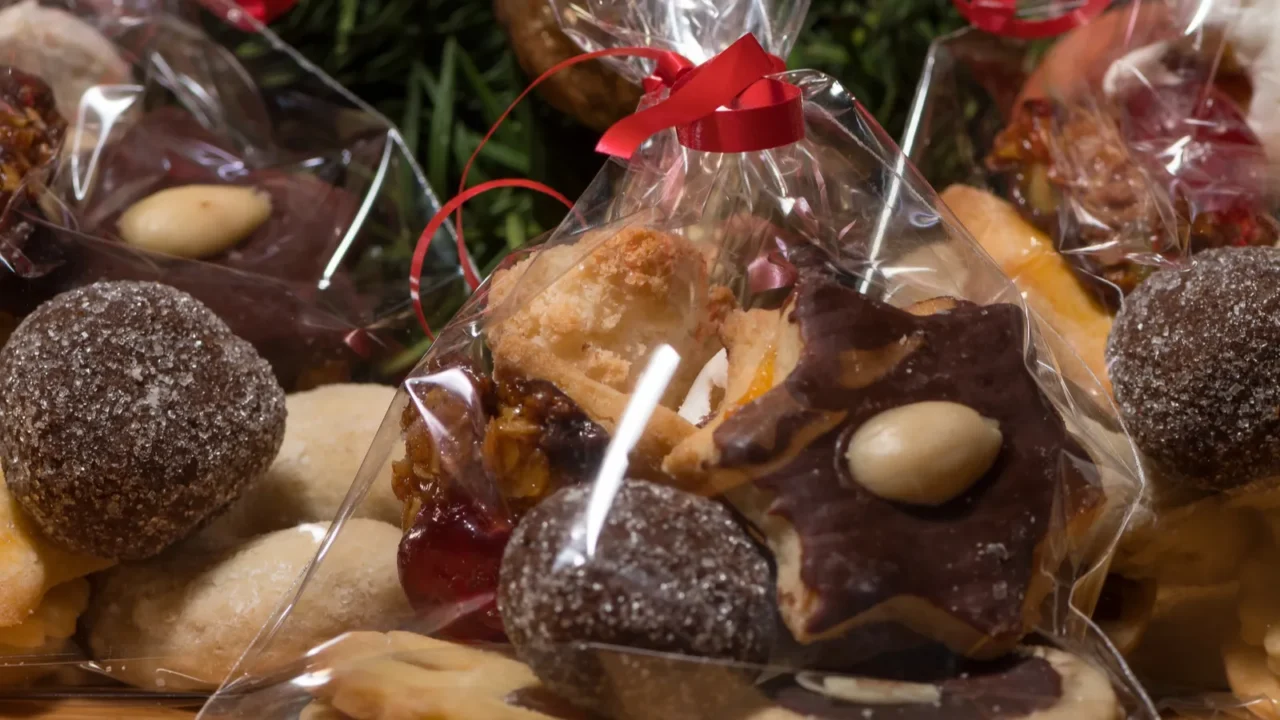 various christmas cookies in front of an advent wreath