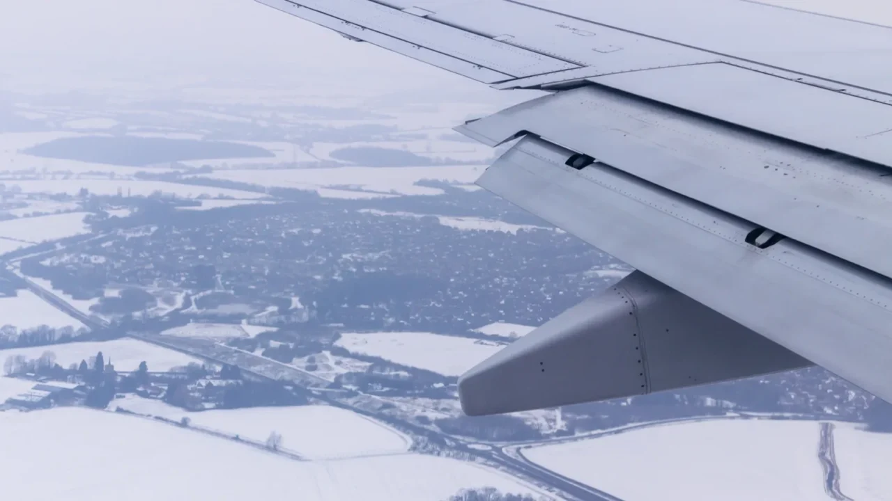 view from airplane window with wing