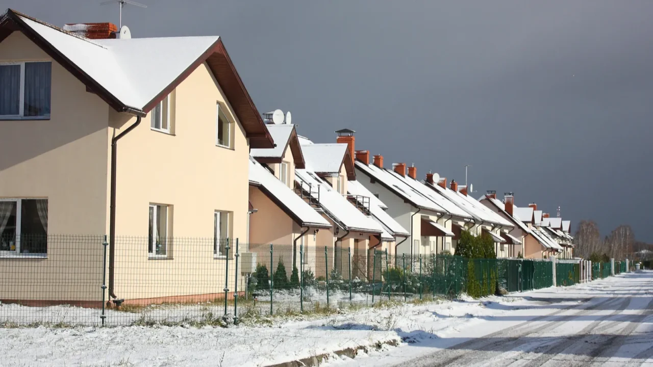 view on street with cottages in winter