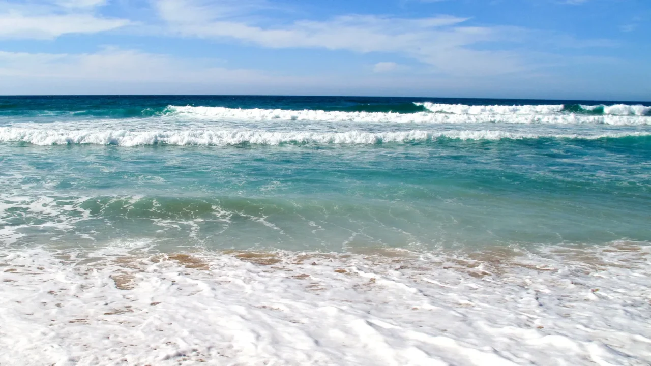 waves breaking on shore of the sea