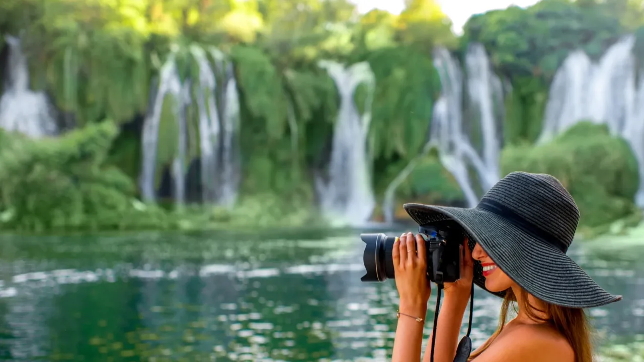 woman tourist near kravica waterfall