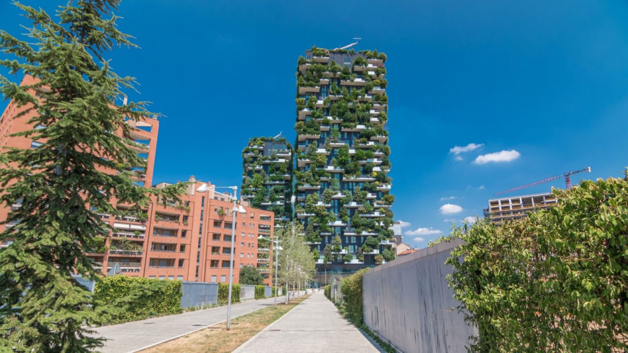 Bosco Verticale or Vertical Forest. It is a pair of two residential towers in the district of Porta Nuova, Milan. they host hundreds of trees and plants in the balconies. Blue cloudy sky at summer day