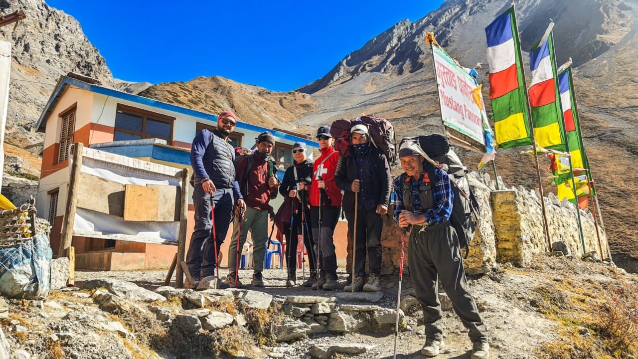A group of travelers with a Sherpa. Kathmandu, Nepal - 21, November, 2024. Trekking along the scenic route in Nepal around Annapurna.