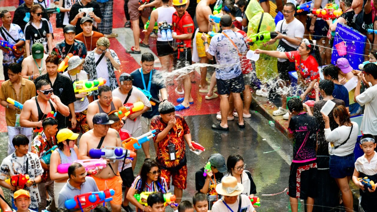 Bangkok, Thailand - April 14, 2025 : Hundreds of thousands of tourists from around the world gather for the Songkran Festival in Silom