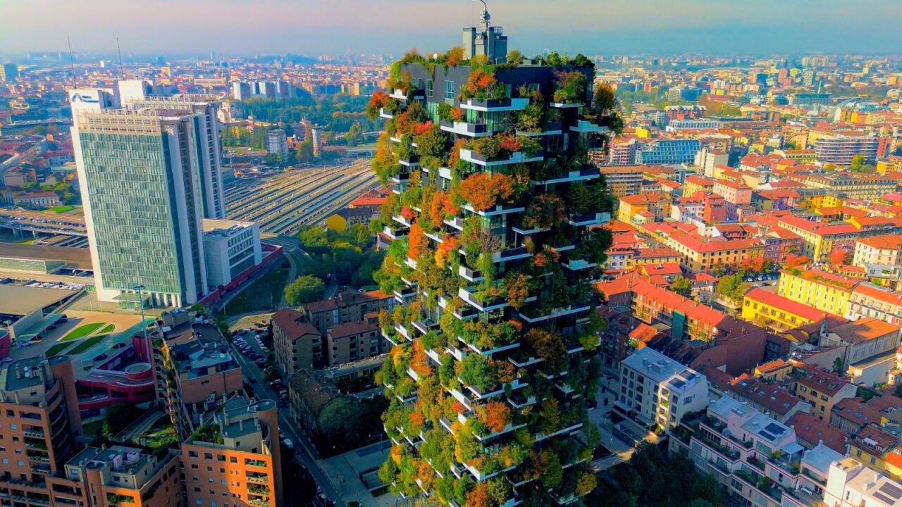 Aerial view of modern and eco-friendly skyscrapers with many trees on every balcony. Bosco Verticale. Modern architecture, vertical gardens, terraces with plants. Green Planet.Italy Milan 28.03.2024