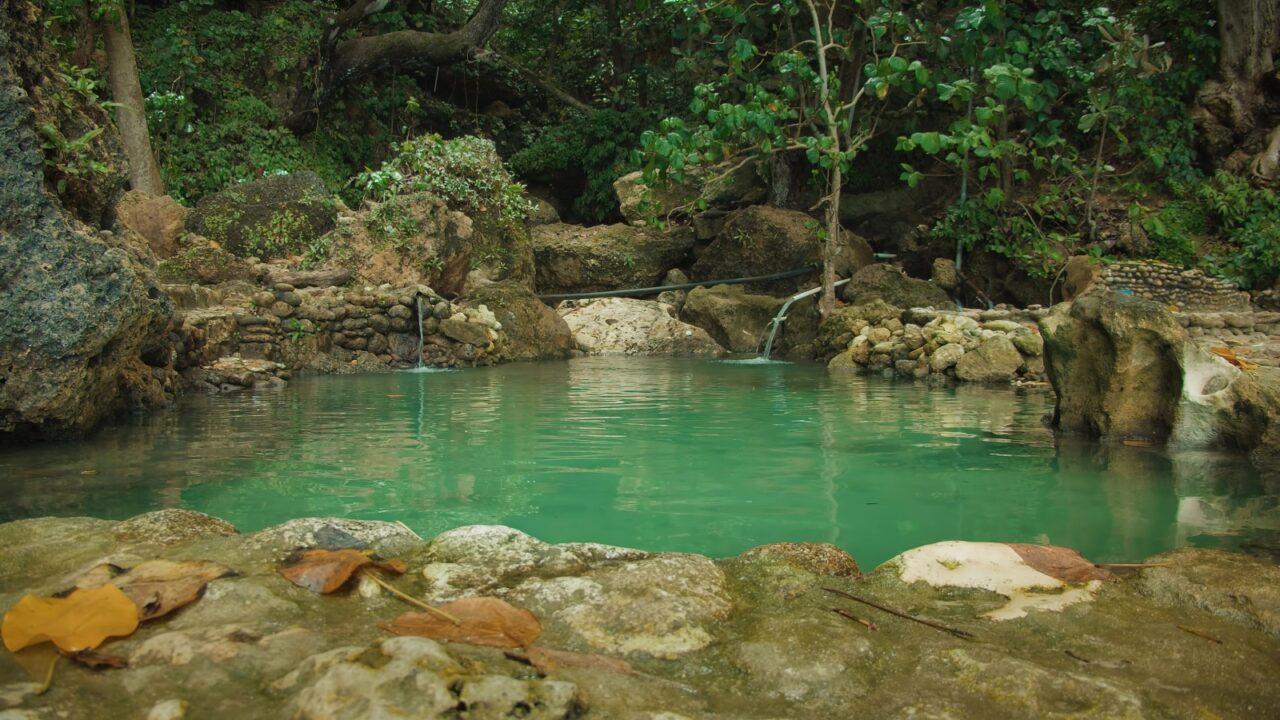 Secluded jungle spring water with natural pool. Hidden within the lush jungle of Bali, a tranquil serene beauty of Tembeling beach, Bali.