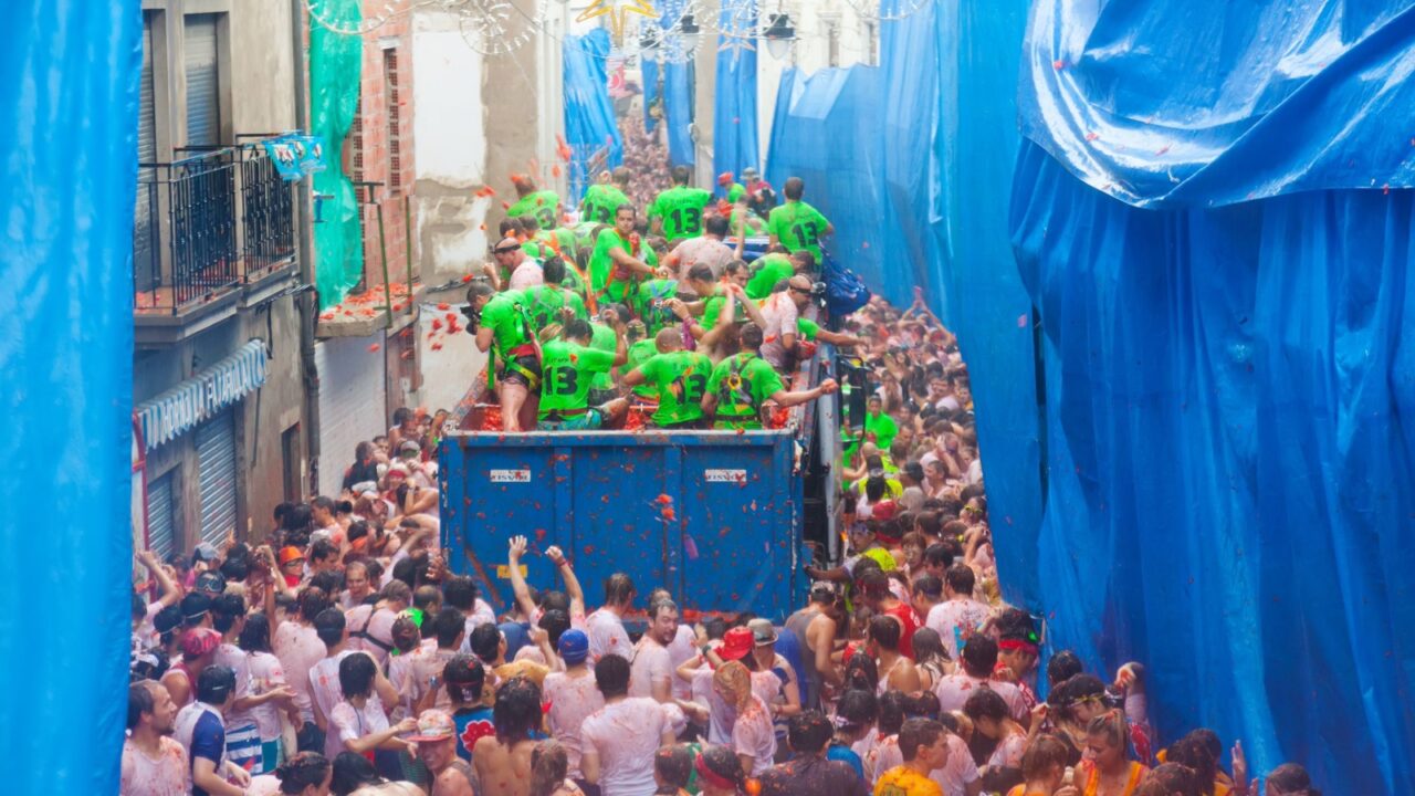 BUNOL, SPAIN - AUGUST 28: Battle of tomatoes - tomatoes madness in August 28, 2013 in Bunol, Spain. La Tomatina festival where people throw tomatoes