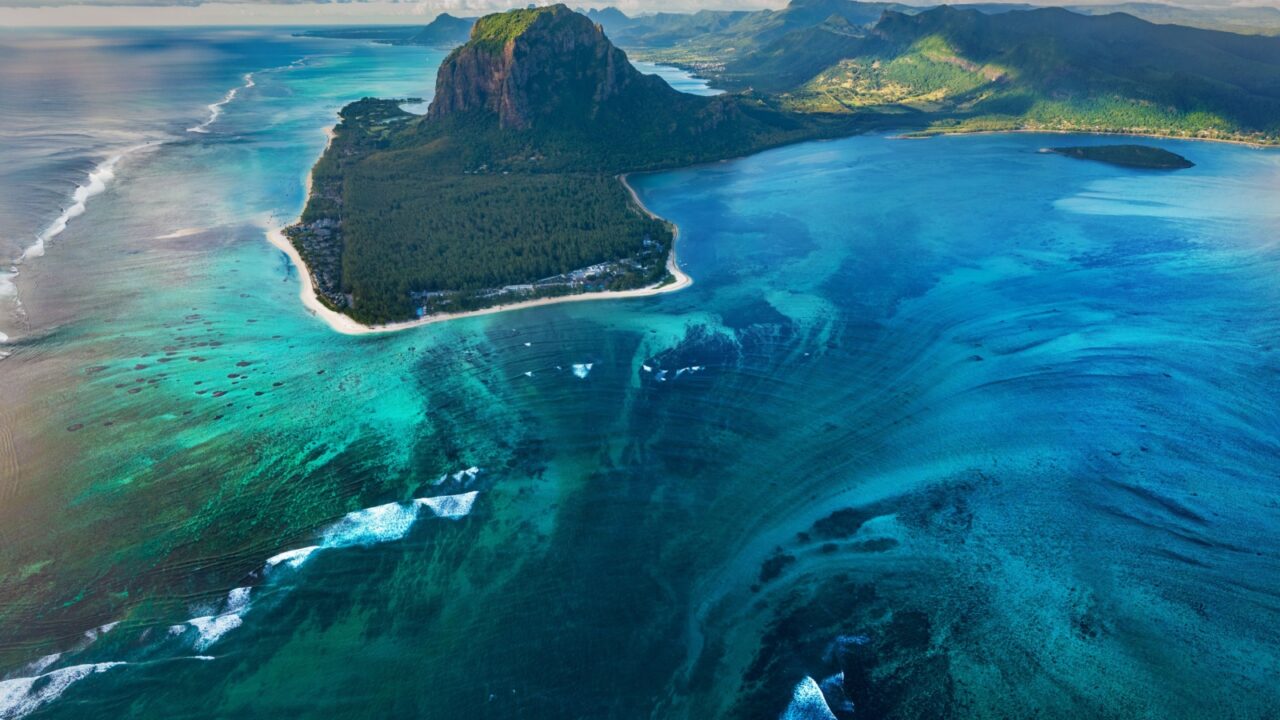 Tropical water, Mauritius island, aerial view of crack in sea bottom, optical illusion of waterfall in clear water