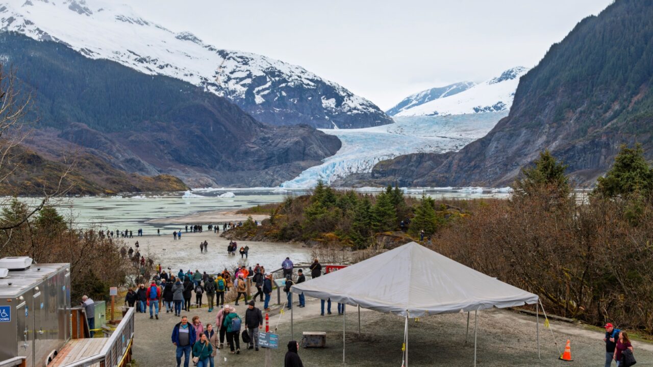 Juneau, Alaska - April 29 2024: Visitors on an overcast Spring day view the Mendenhall Glacier, a 13 mile long glacier located in Mendenhall Valley, Tongass National Forest, near Juneau Alaska