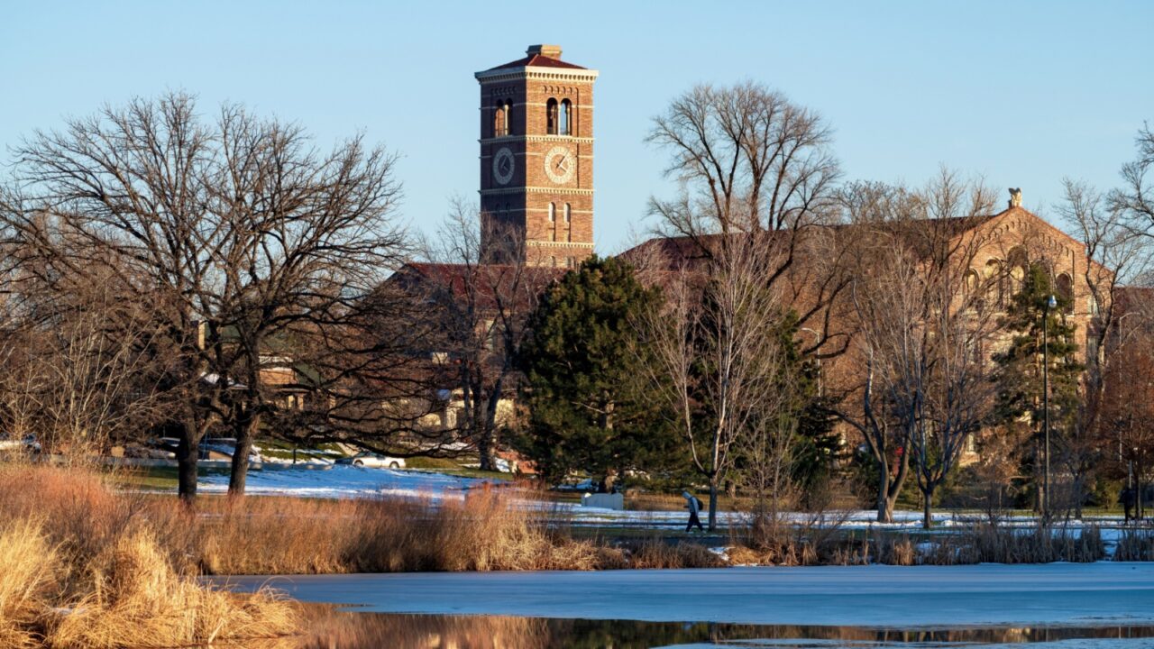 Washington Park in Denver, Colorado in Wintertime with Historic South High School appearing in the background.