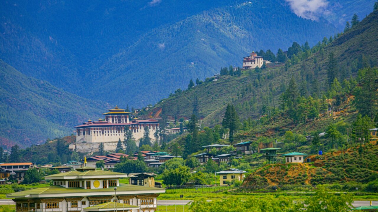 A beautiful photo of Bhutan's only international airport at Paro with the monumental Rinpung Dzong and Ta Dzong (watch tower) in the background