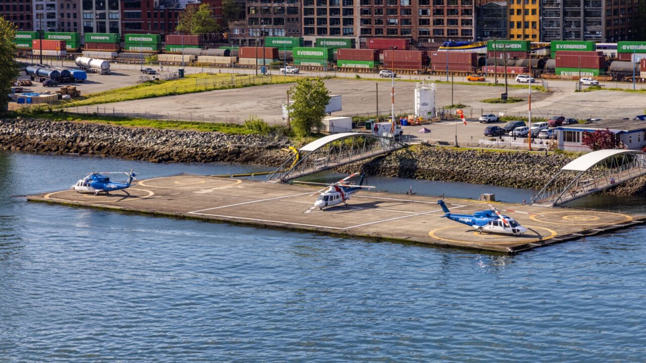 Vancouver, BC, Canada - May 6 2025: Helicopters stationed at a harbor terminal.