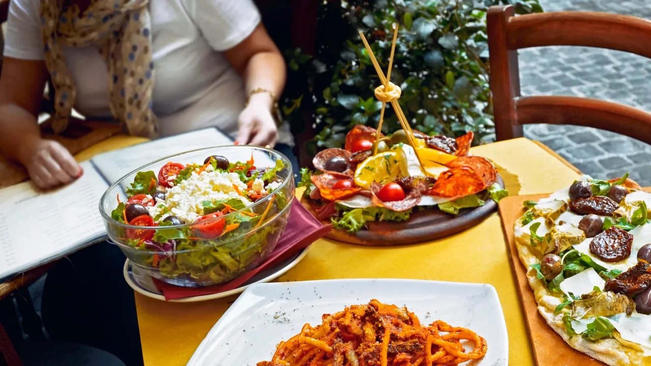 a summer dinner unidentified people eating traditional italian food