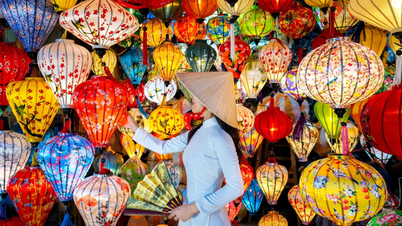 asian woman wearing vietnam culture traditional and hoi an lanterns
