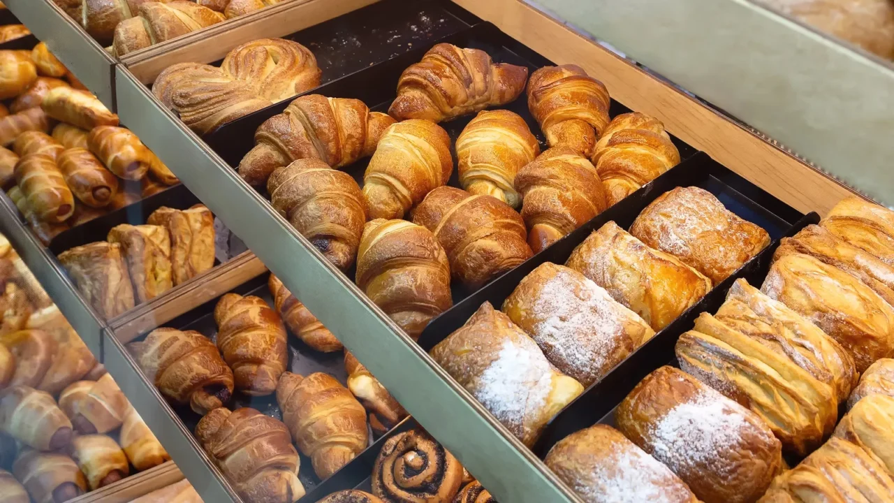 assortments of different bakery products on the bakery showcase food