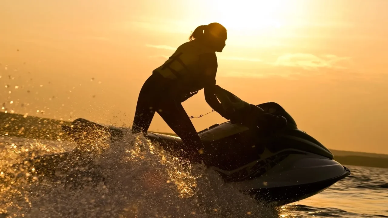 beautiful girl riding her jet skis