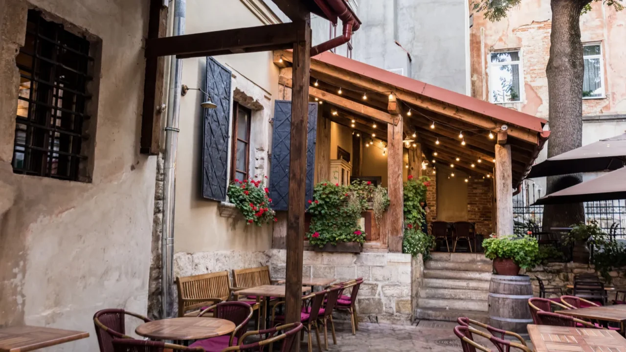 cafe with terrace and wooden tables in city
