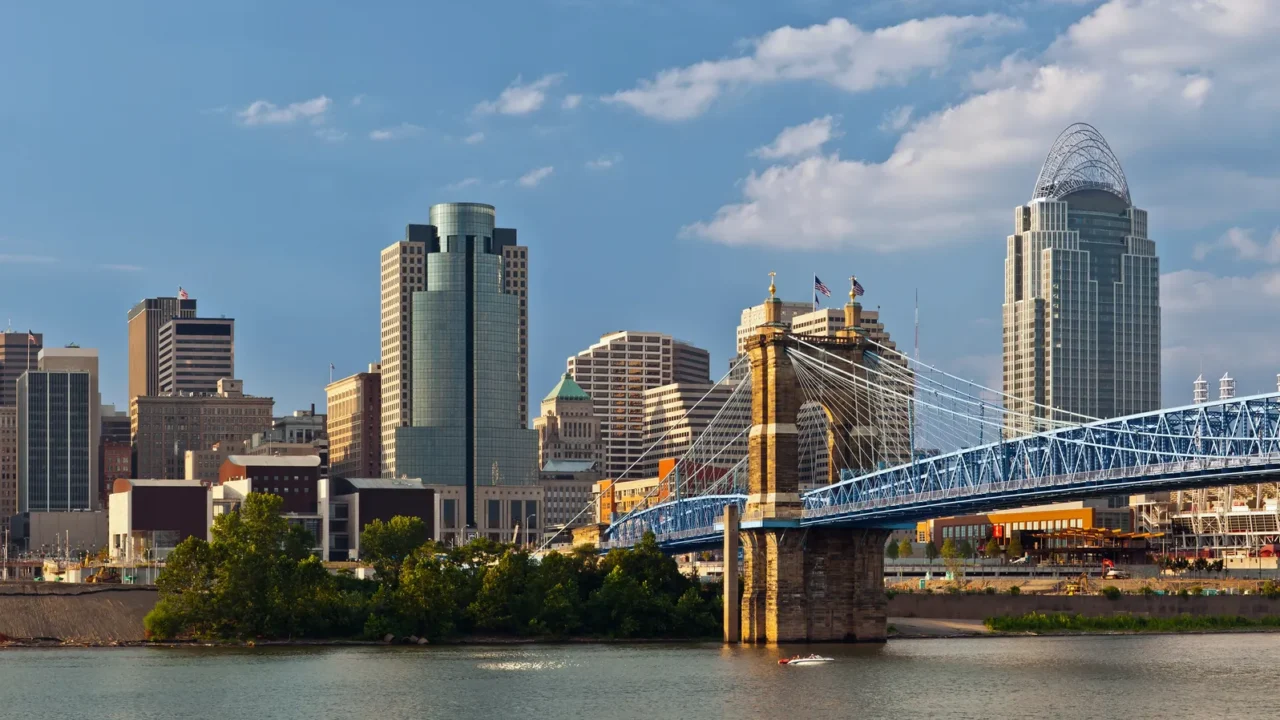 Image of Cincinnati skyline and historic John A. Roebling suspension bridge cross Ohio River.