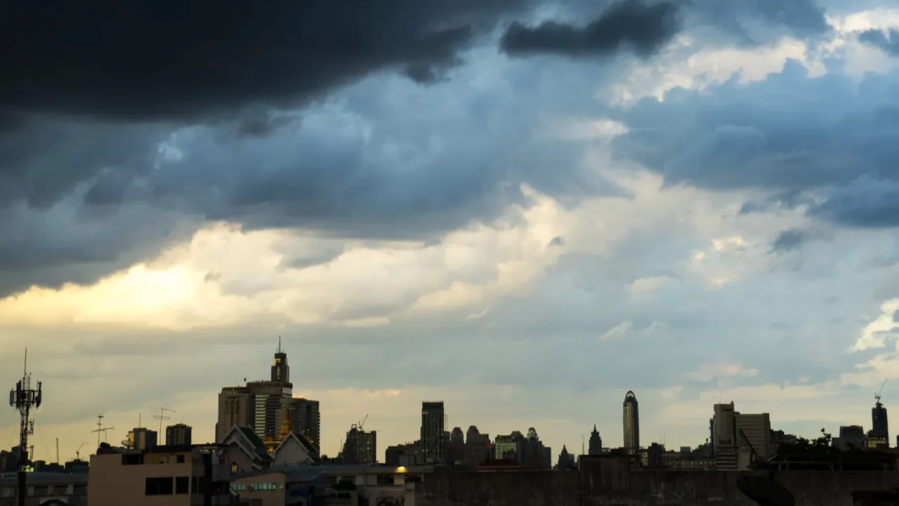 dark blue storm clouds over city in rainy season