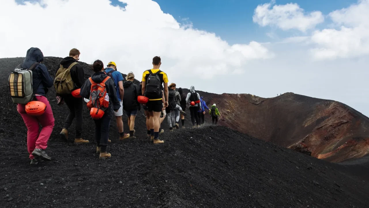 etna volcano italy  august 2016 group of tourists hiking